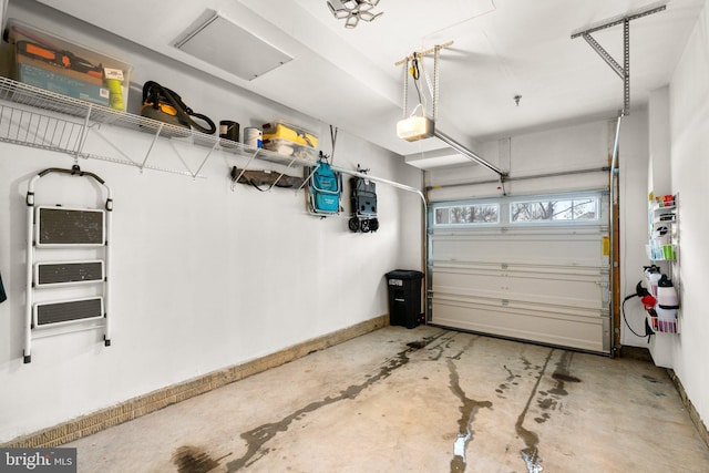 9451 James Macgowan Ln, Owings Mills, MD 21117 - garage featuring baseboards and a garage door opener