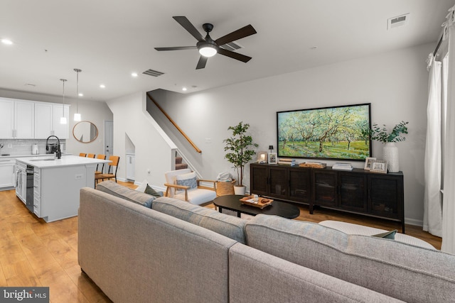 9451 James Macgowan Ln, Owings Mills, MD 21117 - living area with recessed lighting, stairway, light wood-style flooring, ceiling fan, and visible vents