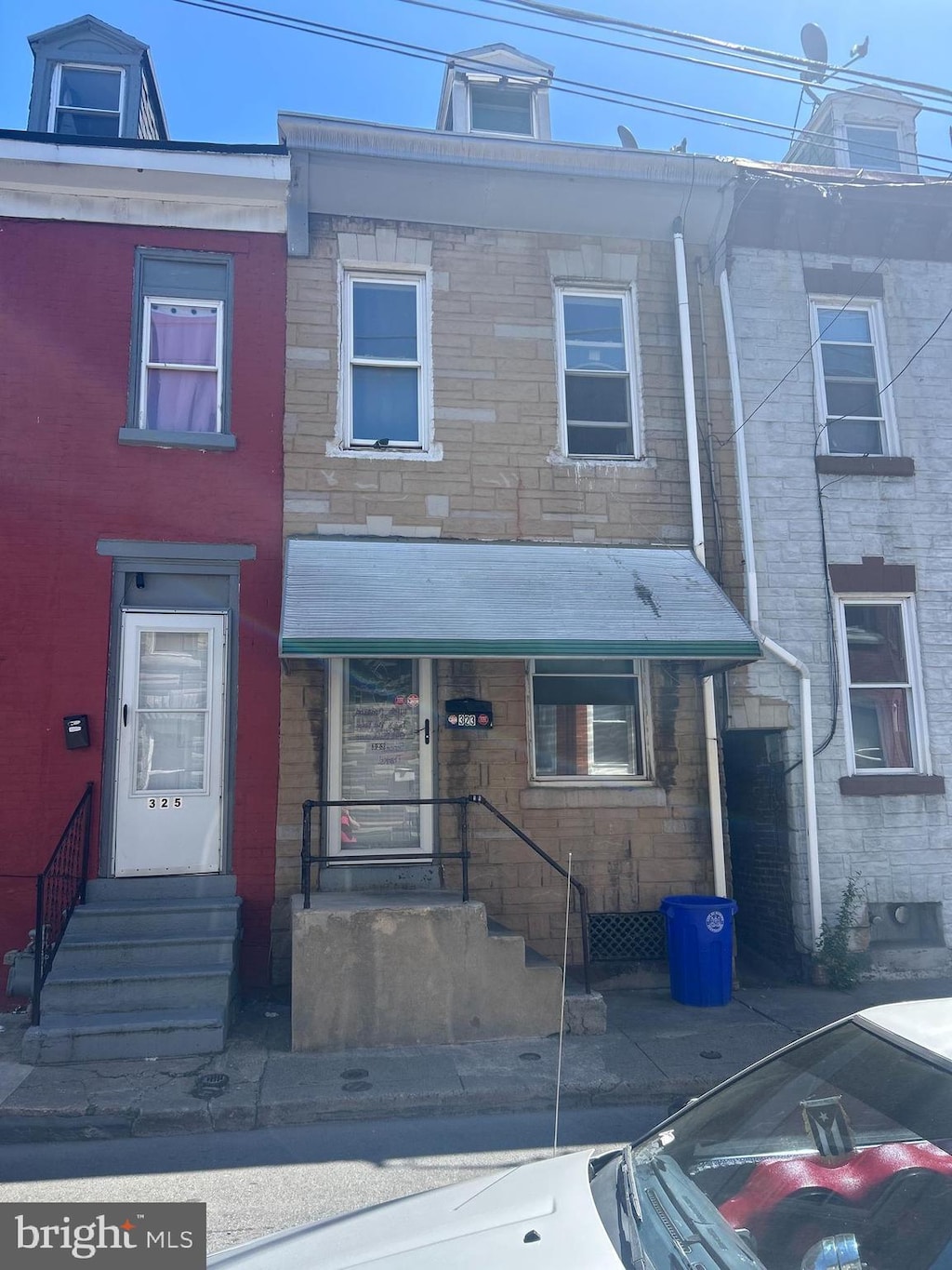323 Moss St, Reading, PA 19604 - townhome / multi-family property featuring stone siding