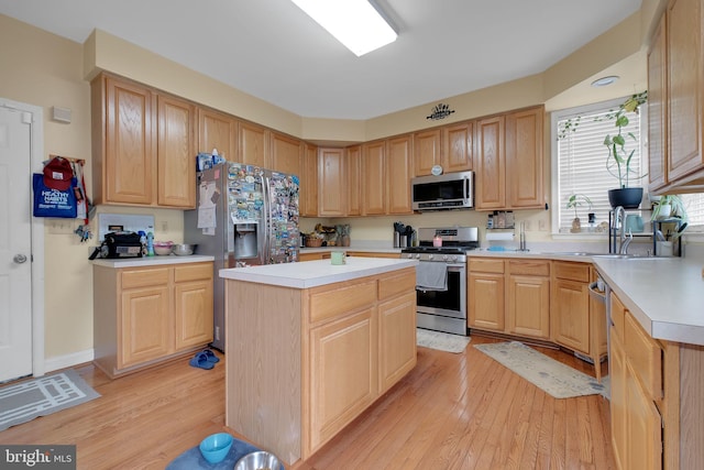 2362 Sequoia Grove St, Waldorf, MD 20601 - kitchen with a sink, light brown cabinets, light countertops, light wood-style flooring, and stainless steel appliances