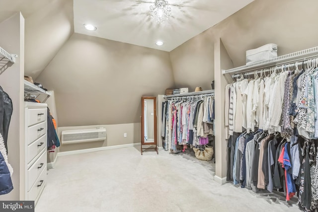 spacious closet featuring lofted ceiling and carpet flooring