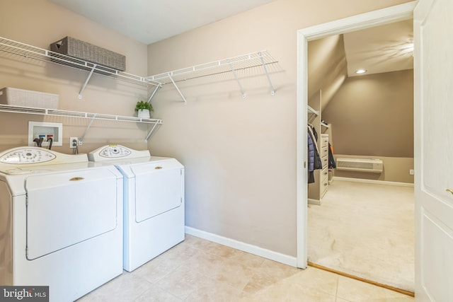 laundry room featuring baseboards, washing machine and clothes dryer, and laundry area