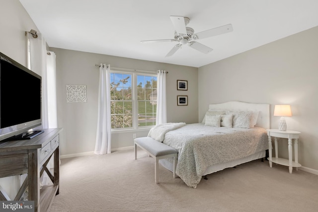 bedroom featuring carpet, a ceiling fan, and baseboards