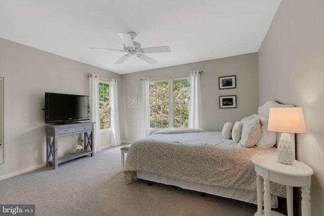 bedroom with baseboards, a ceiling fan, and carpet floors