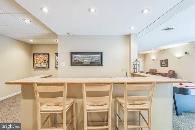bar featuring visible vents, recessed lighting, carpet flooring, and baseboards