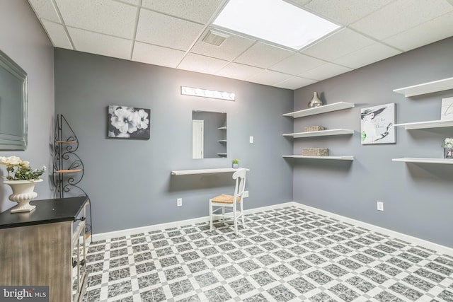 laundry area with baseboards and visible vents