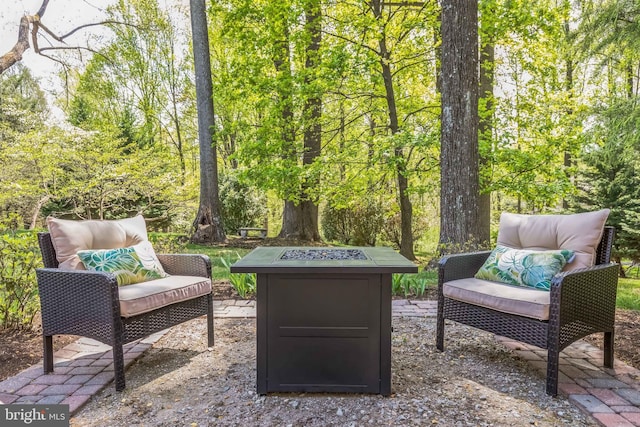 view of patio / terrace featuring an outdoor fire pit