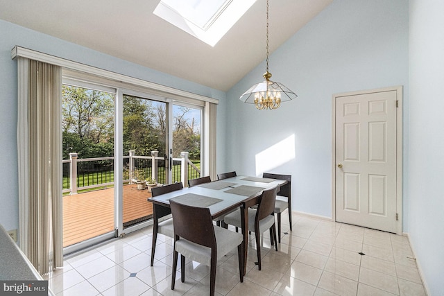 dining area with baseboards, high vaulted ceiling, light tile patterned floors, a notable chandelier, and a skylight