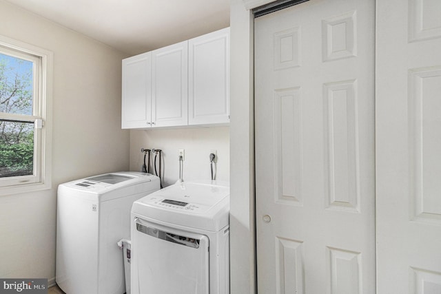 laundry room featuring cabinet space and washer and clothes dryer
