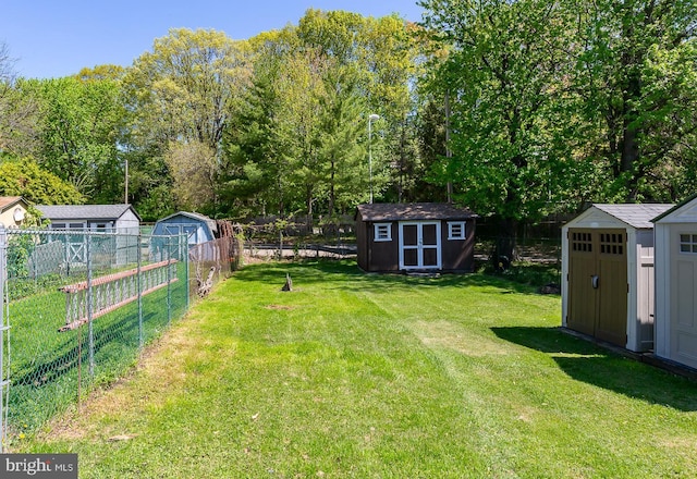 view of yard with a storage unit and an outbuilding
