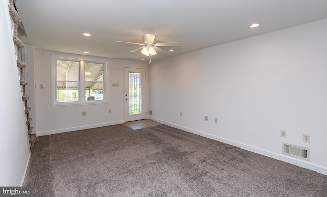 carpeted spare room featuring baseboards, ceiling fan, recessed lighting, and visible vents