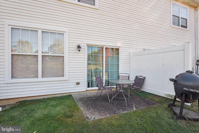view of patio / terrace featuring grilling area and fence