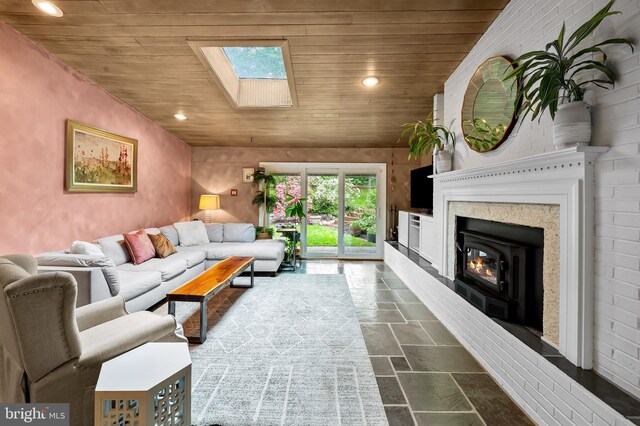 219 Gateswood Rd, Lutherville Timonium, MD 21093 - living room with wooden ceiling, stone tile floors, a skylight, and recessed lighting
