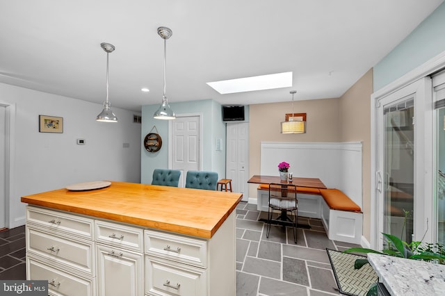 219 Gateswood Rd, Lutherville Timonium, MD 21093 - kitchen featuring pendant lighting, butcher block countertops, recessed lighting, baseboards, and a skylight