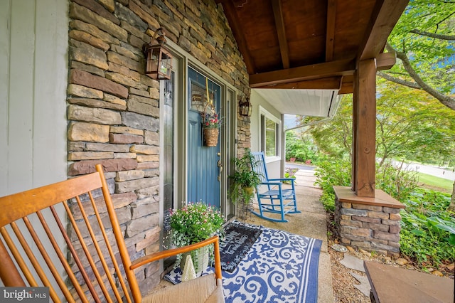 219 Gateswood Rd, Lutherville Timonium, MD 21093 - doorway to property featuring stone siding and a porch
