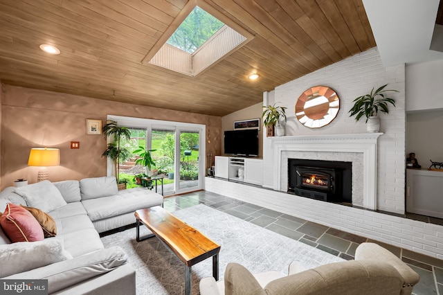 219 Gateswood Rd, Lutherville Timonium, MD 21093 - living room with wooden ceiling, a warm lit fireplace, vaulted ceiling with skylight, and recessed lighting