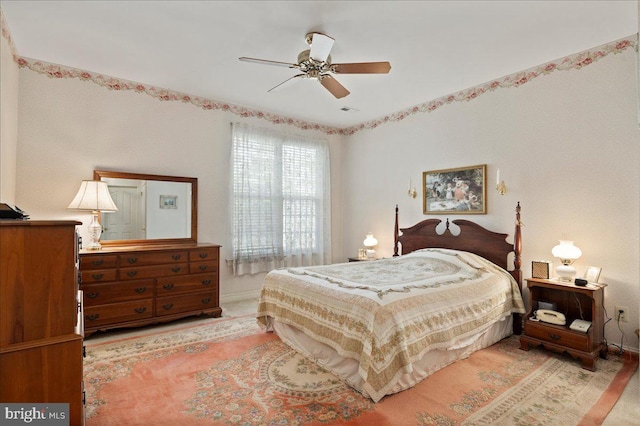 bedroom featuring baseboards and a ceiling fan
