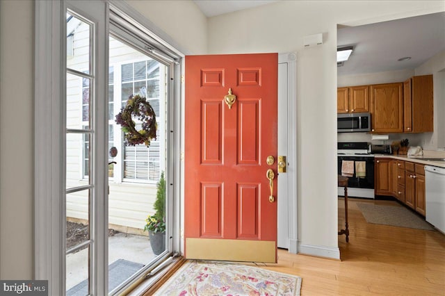 entrance foyer with light wood-style floors