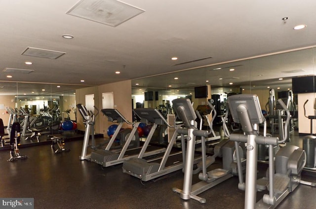 workout area featuring recessed lighting