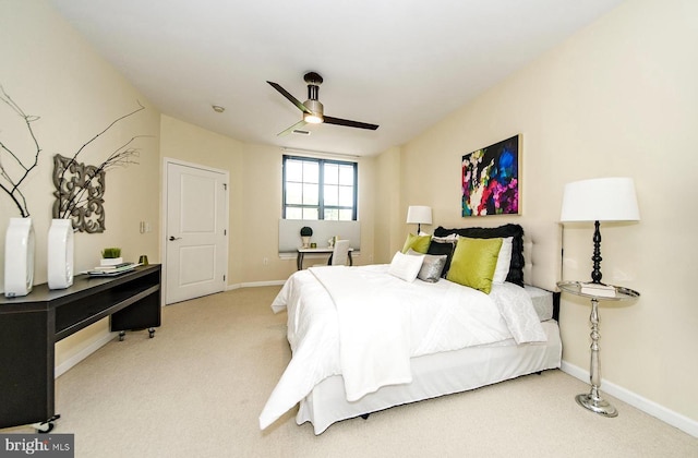 carpeted bedroom with baseboards and ceiling fan