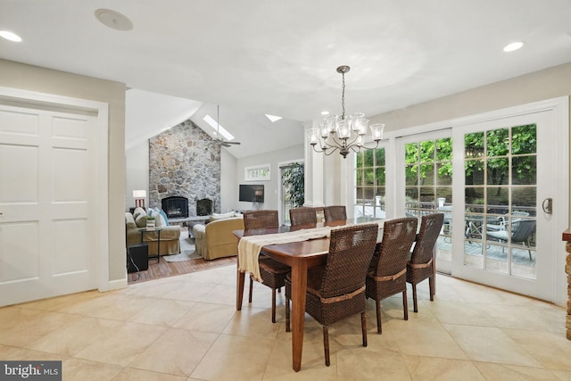 1253 Rowland Dr, Herndon, VA 20170 - dining space with a chandelier, a skylight, a fireplace, lofted ceiling, and light tile patterned floors