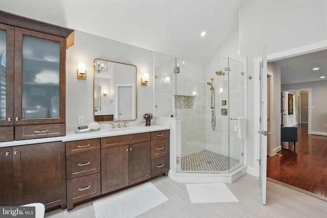 1253 Rowland Dr, Herndon, VA 20170 - bathroom with a stall shower, vanity, baseboards, recessed lighting, and vaulted ceiling