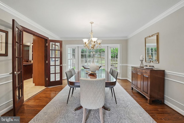 1253 Rowland Dr, Herndon, VA 20170 - dining area with a chandelier, dark wood-style flooring, ornamental molding, french doors, and baseboards