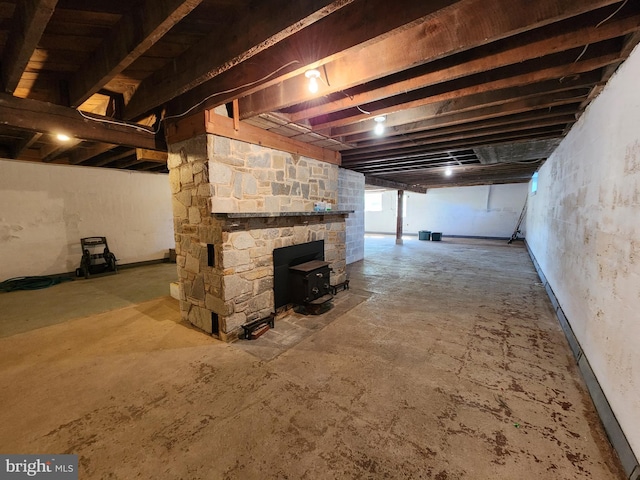 below grade area featuring a wood stove