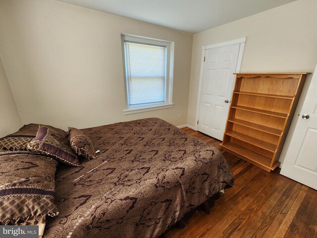 bedroom featuring dark wood-style floors
