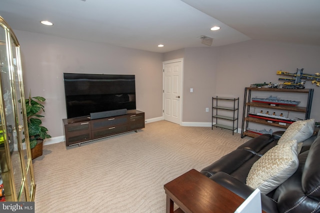 living room featuring baseboards, vaulted ceiling, recessed lighting, and light colored carpet