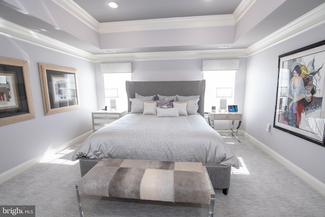 bedroom with carpet floors, a raised ceiling, and crown molding