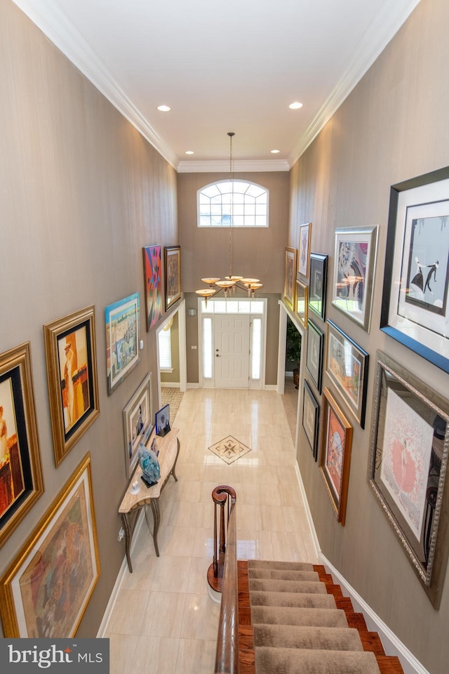 entrance foyer with recessed lighting, baseboards, a chandelier, and light tile patterned floors