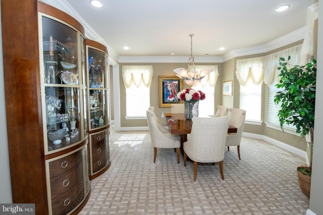 dining room featuring an inviting chandelier, carpet floors, and baseboards