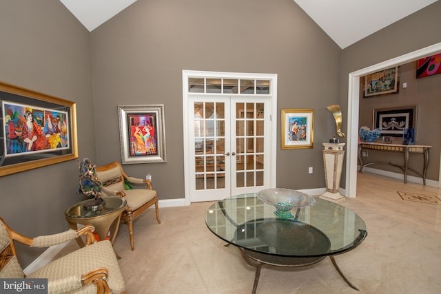 living area featuring carpet floors, baseboards, french doors, and high vaulted ceiling