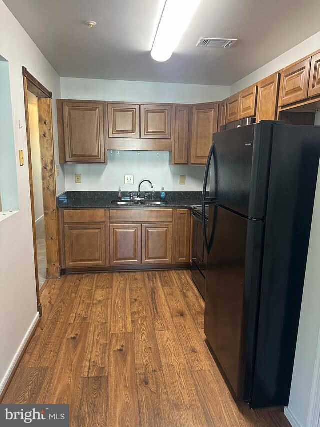 1 Warthens Way Unit H, Emmitsburg, MD 21727 - kitchen with black appliances, a sink, dark wood-type flooring, and brown cabinets