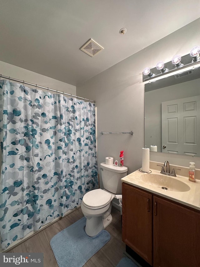 1 Warthens Way Unit H, Emmitsburg, MD 21727 - full bathroom with wood finished floors, toilet, vanity, and a shower with shower curtain