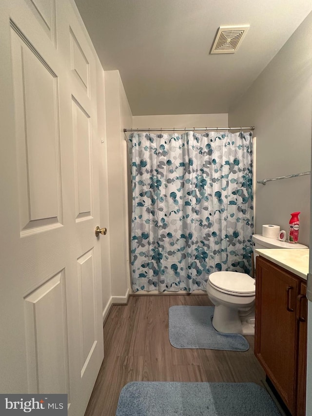 1 Warthens Way Unit H, Emmitsburg, MD 21727 - bathroom with wood finished floors, toilet, vanity, and curtained shower