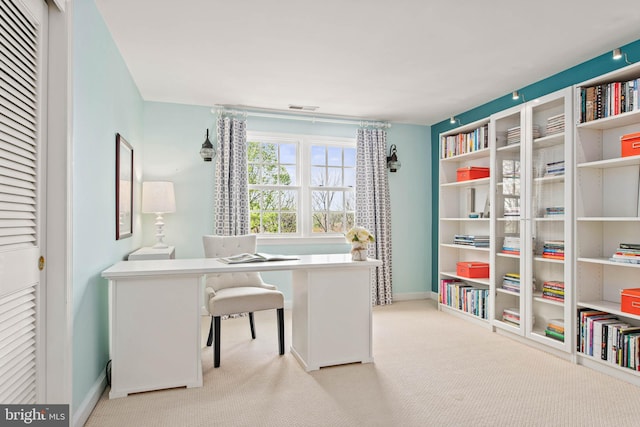 office area with baseboards and carpet