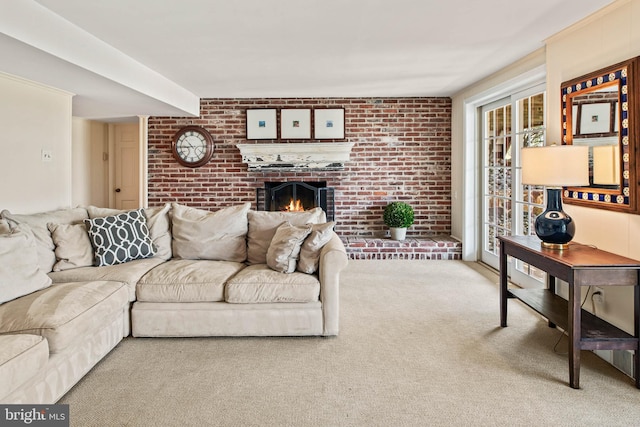 living room with carpet floors, a fireplace, and brick wall