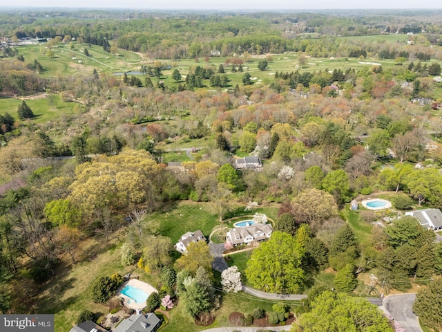 drone / aerial view featuring a view of trees