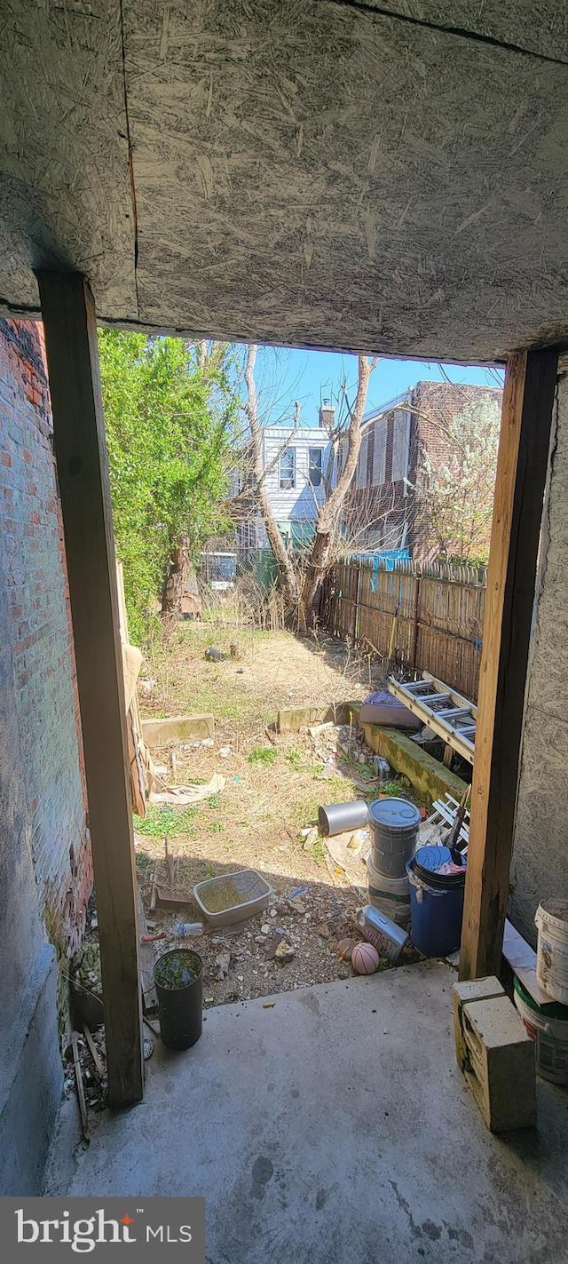 view of yard with fence and a patio