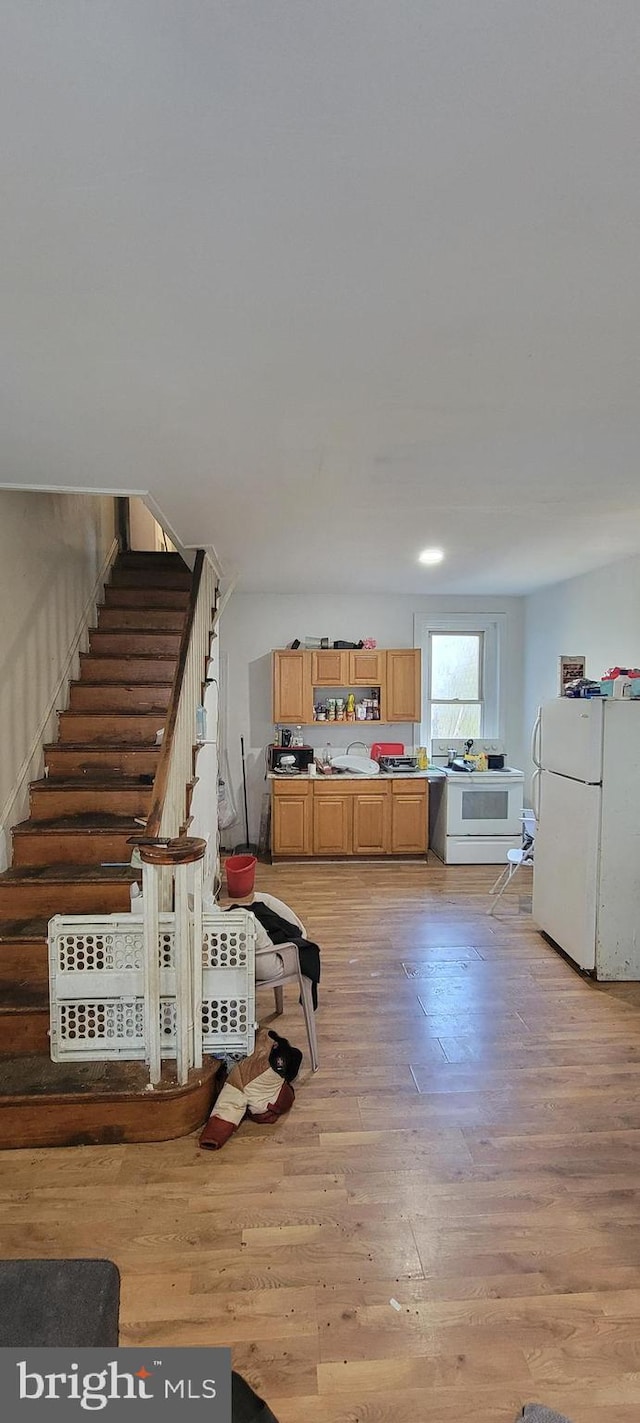 interior space with light wood-style floors and stairs