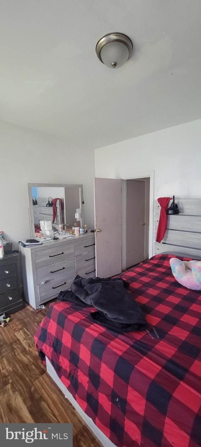 bedroom with wood finished floors