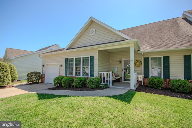 ranch-style house featuring an attached garage, a front lawn, driveway, and covered porch