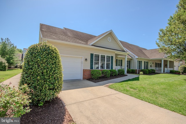 ranch-style home with a porch, a front yard, brick siding, concrete driveway, and an attached garage