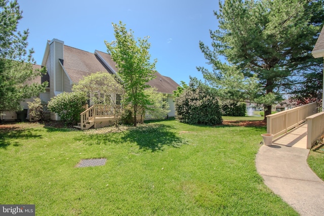 view of yard with a deck
