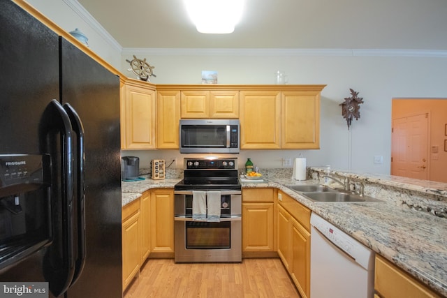 kitchen featuring crown molding, light brown cabinets, a sink, light wood-style flooring, and appliances with stainless steel finishes