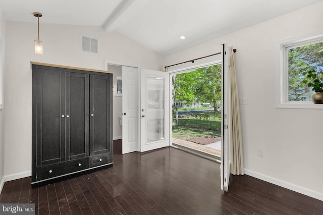 unfurnished bedroom with access to exterior, visible vents, wood finished floors, baseboards, and lofted ceiling with beams