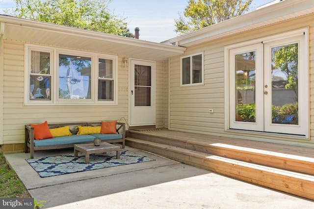 back of house with a patio, a wooden deck, and an outdoor hangout area