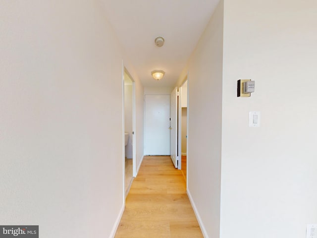 4600 Duke St Unit 1018, Alexandria, VA 22304 - corridor featuring baseboards and light wood-style floors